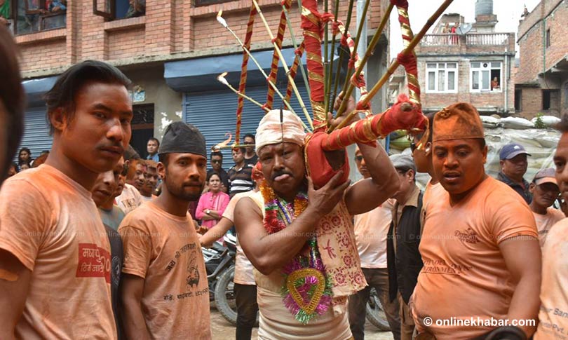 File: Buddha Krishna Baga Shrestha pierces his tongue to mark the annual Jibro Chhedne Jatra, in Bode of Bhaktapur, on Sunday, April 15, 2018.