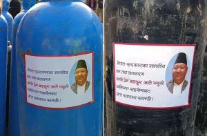 ‘Viral minister’ Ale sticks his own pic on oxygen cylinders including ones received as aid