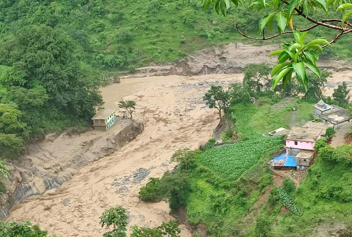 File: Flooded Kharkhola river in Naugad of Darchula on Thursday, July 8, 2021.