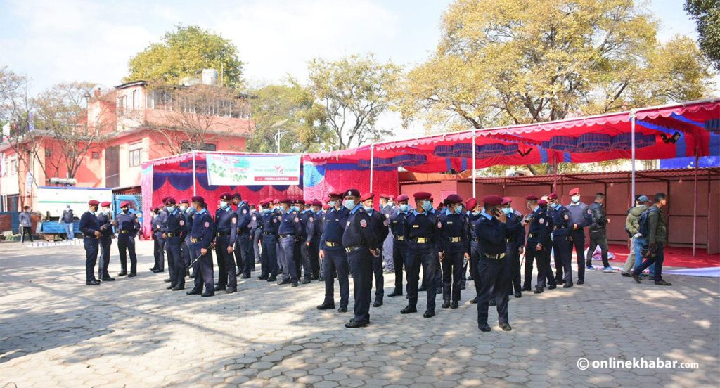 Nepal Police personnel guard the venue set for the opening ceremony of the 14th general convention of the Nepali Congress, on Friday, December 10, 2021.