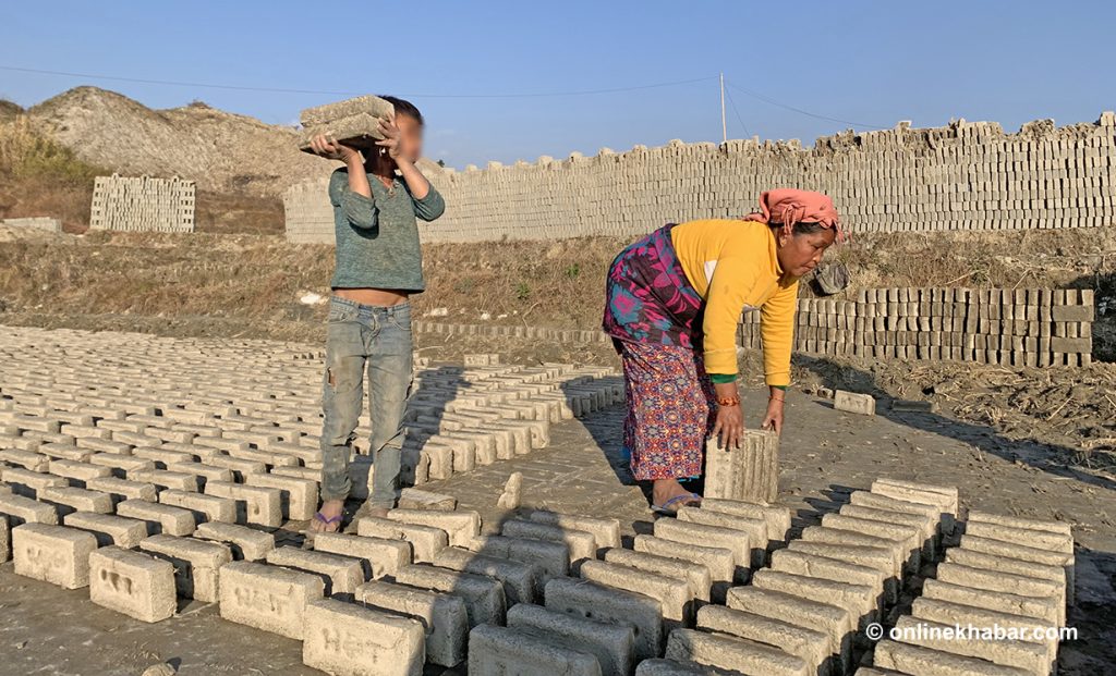 Child labour A child and a woman working in a brick kiln.