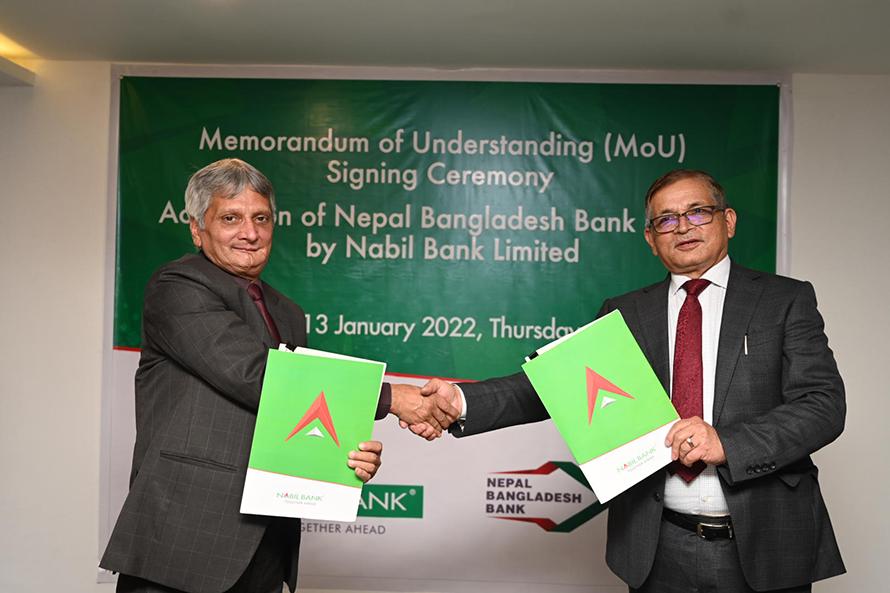 Officials of Nabil Bank and Nepal Bangladesh Bank sign and exchange an merger agreement, in Lalitpur, on Thursday, January 13, 2021.