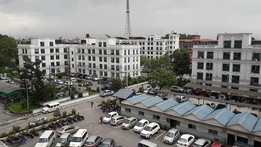 File: Buildings and vehicles inside Singhadarbar, the main administrative complex of the federal government.