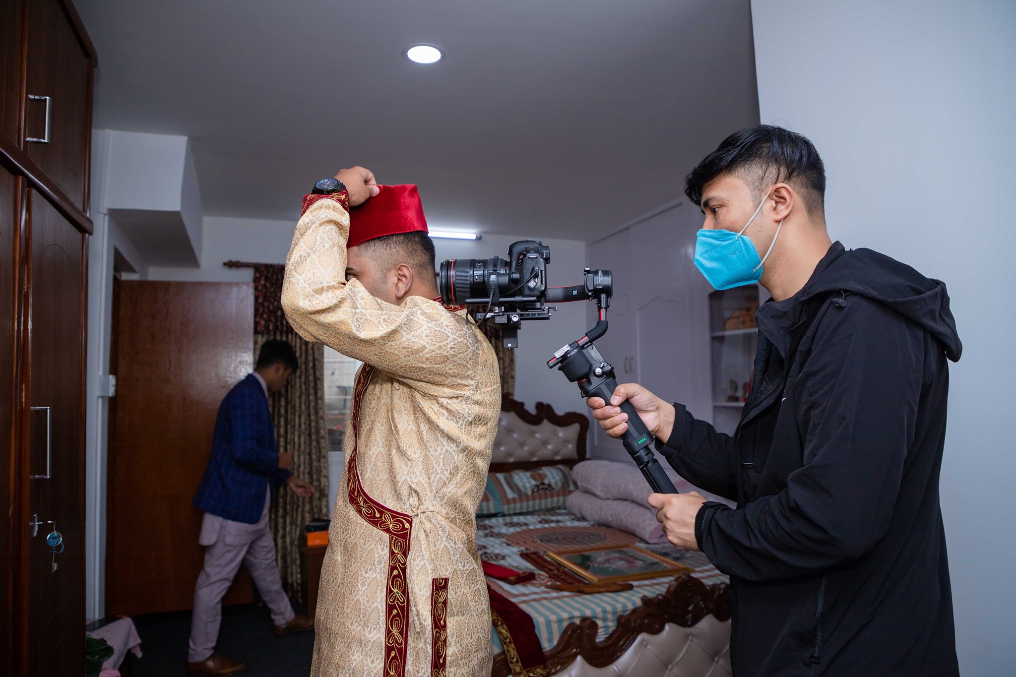 A wedding photographer from Sanzu Production clicking the groom. Photo: Sanzu Production