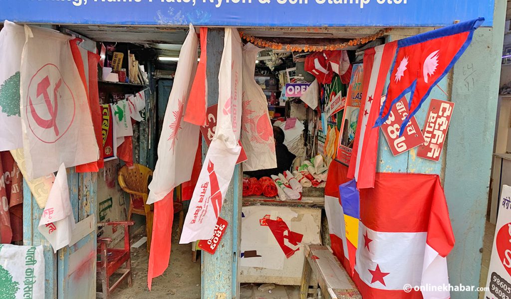 A shop displays party flags in Bagbazar of Kathmandu, ahead of local elections, in April 2022.