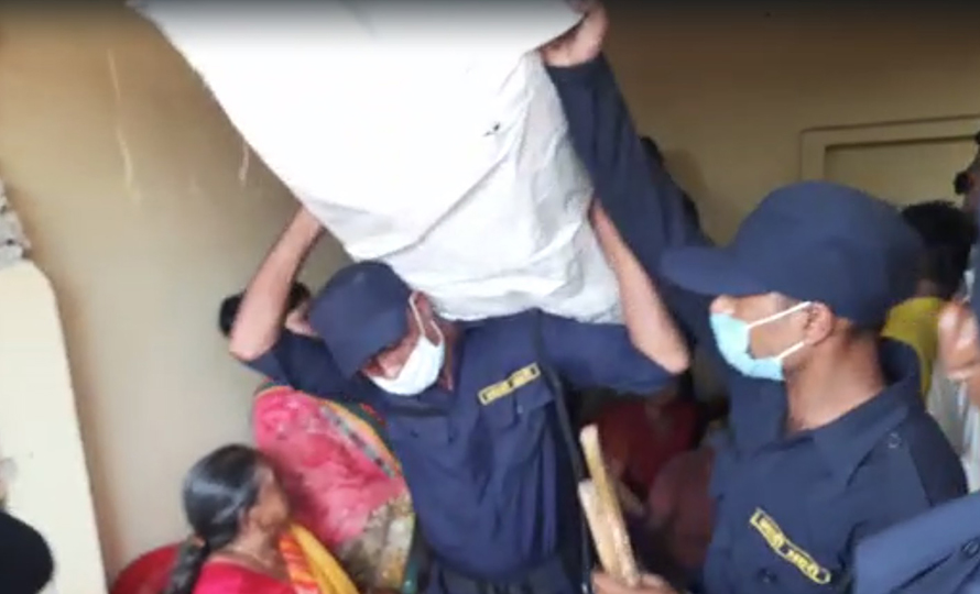 Police confiscate umbrellas from Janata Samajbadi Party Nepal (JSPN)'s office near a polling station in Birgunj.