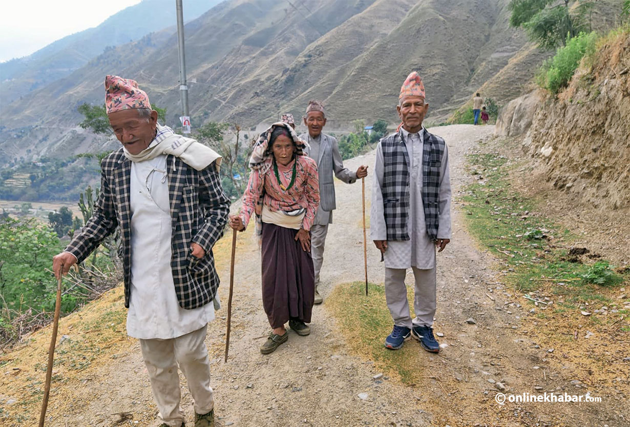 Senior citizens walk towards a voting station to cast their ballots, in Nepal, on Friday, May 13, 2022.