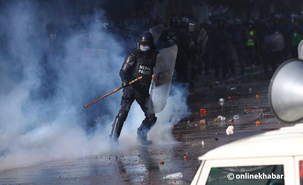 Police use water cannons to stop the Durga Prasai group from marching towards no-protest zone