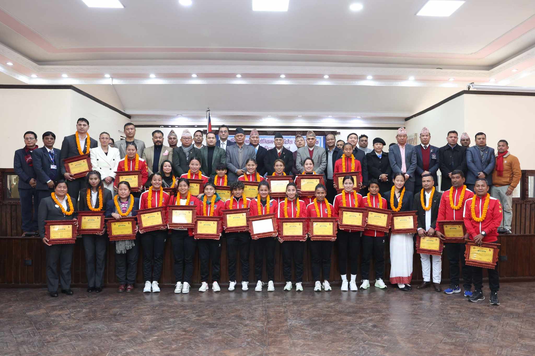 PM Oli hands prize to medal winning players of int’l sports championship