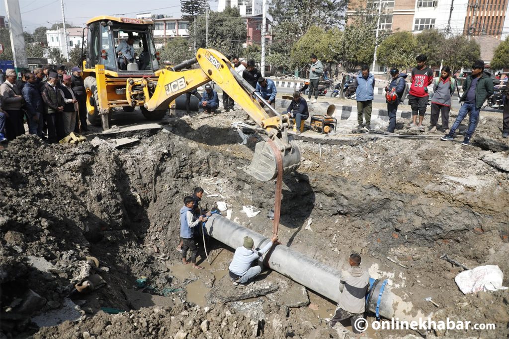 Repair work underway on burst Melamchi water pipeline in Babarmahal (Photos)